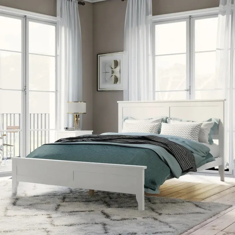 Letto a piattaforma in legno massello con testiera