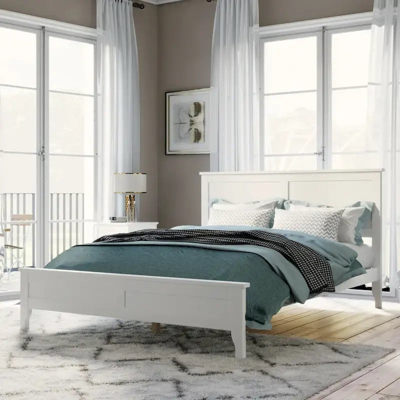 Letto a piattaforma in legno massello con testiera